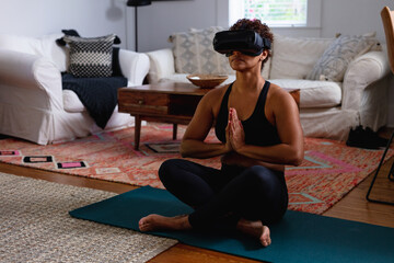 Woman African-American doing virtual reality breathing, relaxation, and meditation exercise