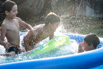 Boys playing in swimming pool