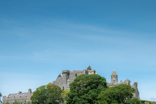 Rock of Cashel against clear blue sky during sunny day, Tipperary, Ireland