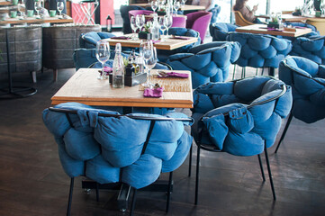 Caffee restaurant interior empty table blue chairs