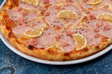 fresh pizza on the white plate