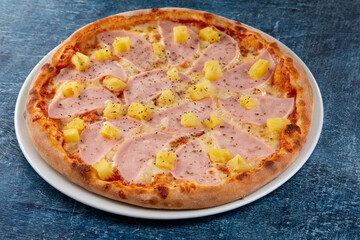 fresh pizza on the white plate