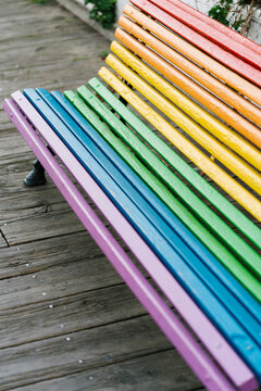 Multi colored painted bench at park