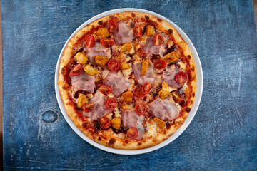 fresh pizza on the white plate