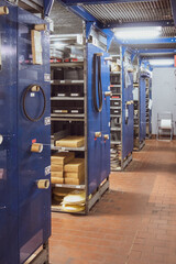 Naklejka premium in a car workshop there are shelves with many spare parts