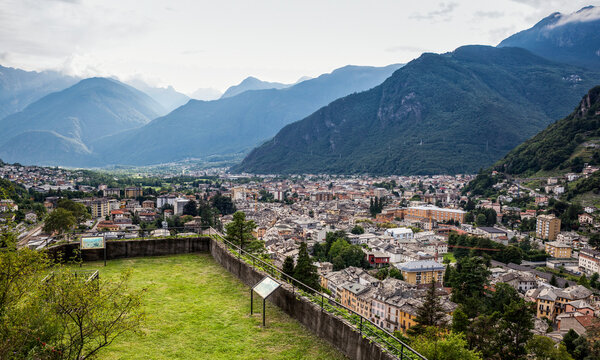 Townscape against mountain seen through Parco Archeologico Botanico del Paradiso, Valchiavenna, Chiavenna, Province of Sondrio, Lombardy, Italy