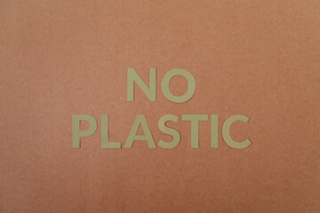 No Plastic cardboard letters on a craft paper