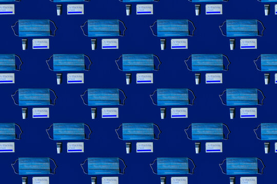 Pattern of protective face masks against blue background