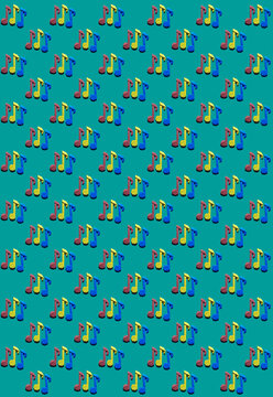 Pattern of red, blue and yellow origami notes against green background