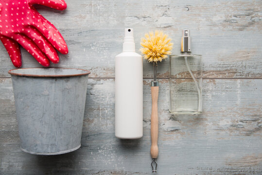 Cleaning utensils lying on wooden surface