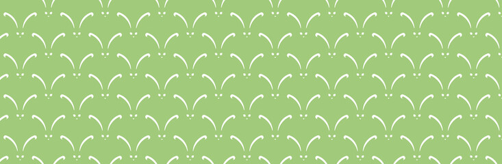 Zielone tło z białymi zajączkami na wielkanoc
