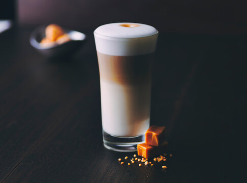 Glass of latte macchiato with caramel