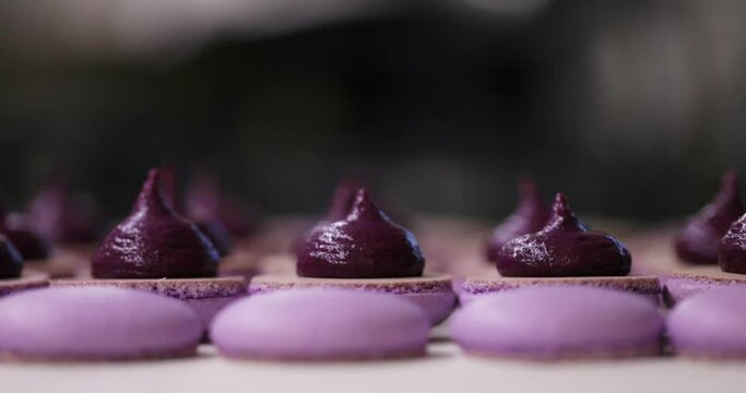 Process of making macaron macaroon, french dessert, squeezing the dough form cooking bag