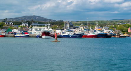 Fototapeta na wymiar View of harbour and otwn of Castletown Bere in the south of Ireland and the mountains at the background.