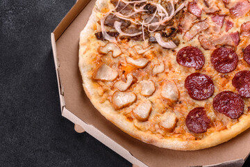Fresh delicious pizza made in a hearth oven with four types of meat and sausage