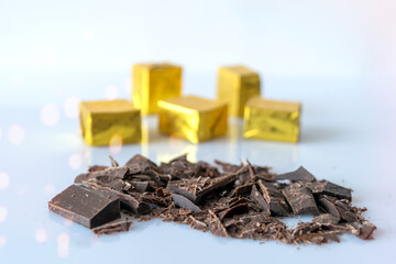 Chocolate shavings on a white background. Bokeh. Selective focus.