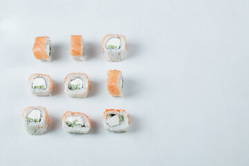 Mini sushi rolls with red caviar and cream cheese