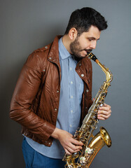 Obraz na płótnie Canvas saxophone players background. Saxophonist jazz man musician 