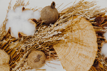 Boho wreath with cotton plant and wheat. Boho background 