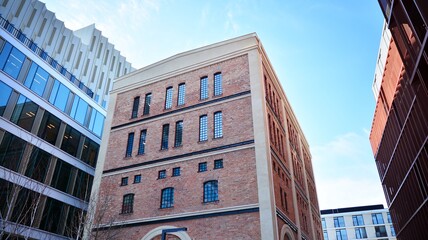 Revitalized red brick building and modern office building.
