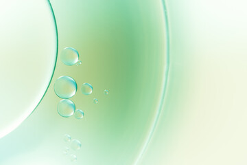 Closeup of abstract background with round shaped cells of vaccine of different sizes illuminated by colorful light