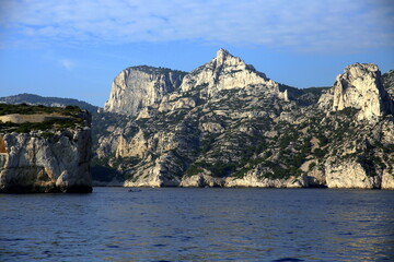 Fototapeta na wymiar Frontal view of the cliff between the blue of the sea and the sky, Parc National des Calanques, Marseille, France