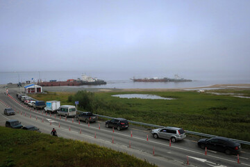 Fototapeta premium Ferry view between Salekhard and Labytnangi by misty morning, Yamalo-Nenets Autonomous Region, Russia