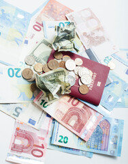 Cash on table isolated: dollars, euro, rubl broken money. All in mess, global crisis . passport travel concept