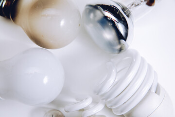 Fototapeta na wymiar White lightbulbs on a white background. Old light bulbs. Concept of energy 