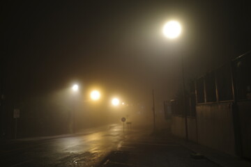 Suburbs of the city in a foggy night