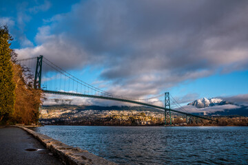 lions gate bridge in the morning with cloudy sky backgrounds