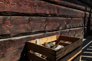 wooden dark wall and wooden box with logs