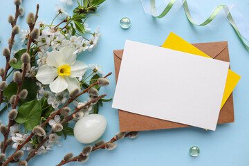 Easter card mockup made of Easter eggs, spring flowers and space for text 