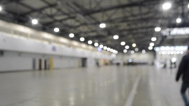 Large open and empty part of a large building inside.