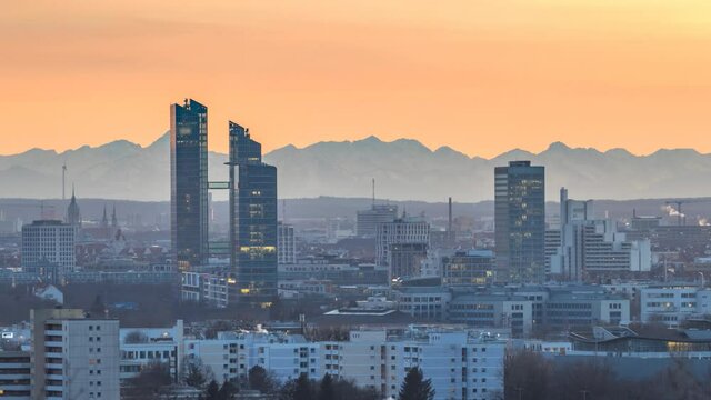 Munich  panoramic view, munich skyline aerial view time lapse from day to night, munchen skyscrapers buildings alps mountains.
