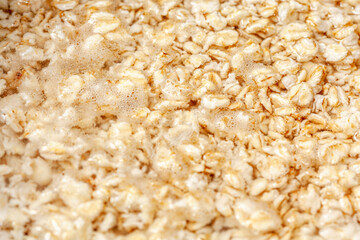 Oatmeal boiling , cereals preparation for breakfast 
