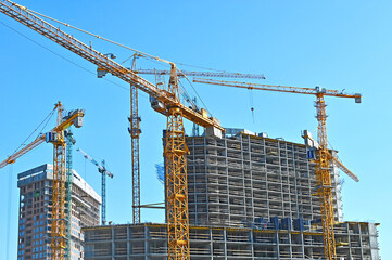 Crane and highrise construction site