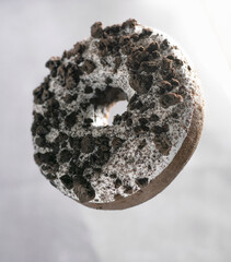 Ring donut with white icing and chocolate pieces