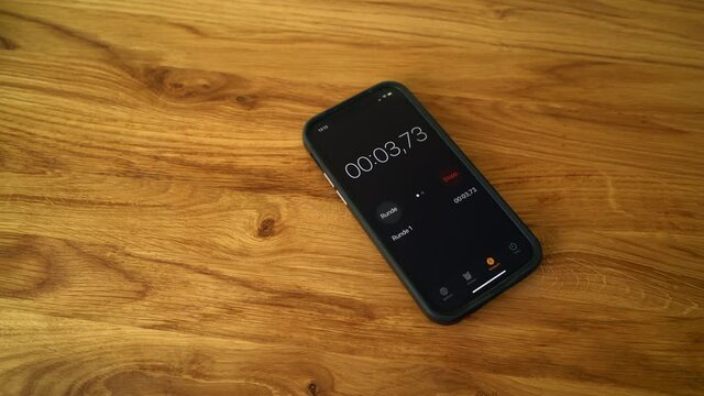Smartphone Stopwatch on wooden Table