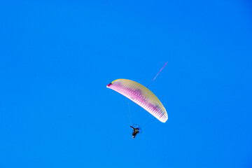 paragliding in the blue sky
