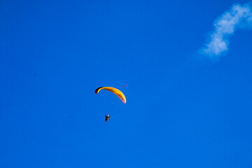 paragliding in the blue sky