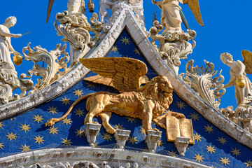 Lion of Saint Mark on the facade of St Mark's Basilica in Venice, Italy