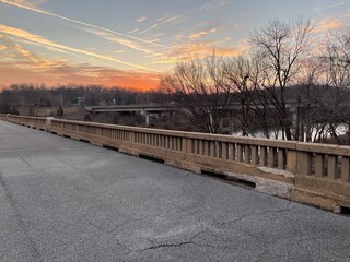 Naklejka premium sunset over abandoned bridge