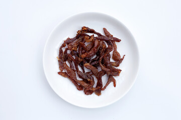 Deep fried sun-dried pork on dark background