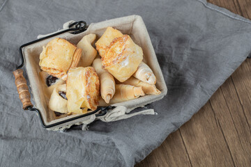 Cookies in a metallic container on the white towel
