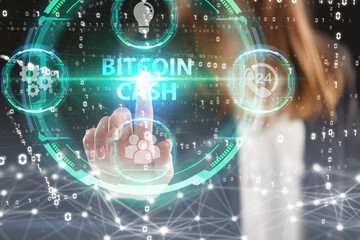 Business, Technology, Internet and network concept. Young businessman working on a virtual screen of the future and sees the inscription: Bitcoin cash