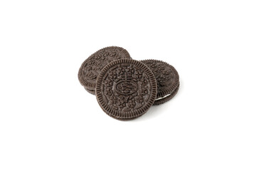 Biscuits chocolate  with crumbs on white background. It is a chocolate cookies with a sweet cream.