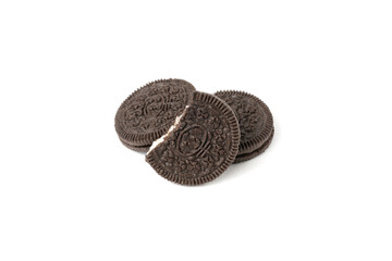 Biscuits chocolate  with crumbs on white background. It is a chocolate cookies with a sweet cream.