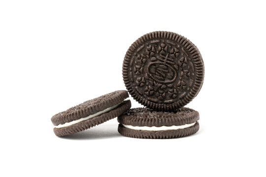 Biscuits chocolate  with crumbs on white background. It is a chocolate cookies with a sweet cream.