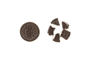 Biscuits chocolate  with crumbs on white background. It is a chocolate cookies with a sweet cream.